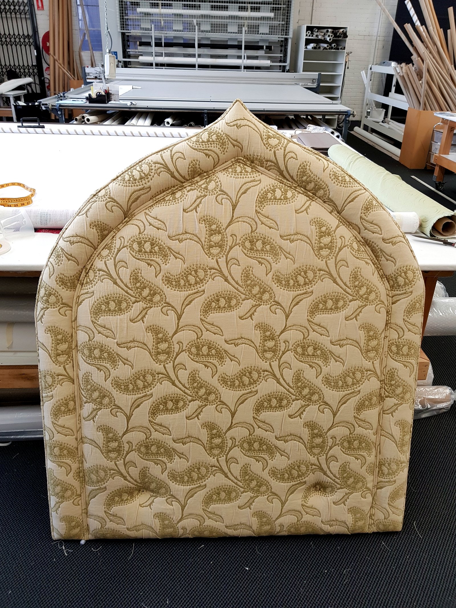 Custom gold paisley arch bed head