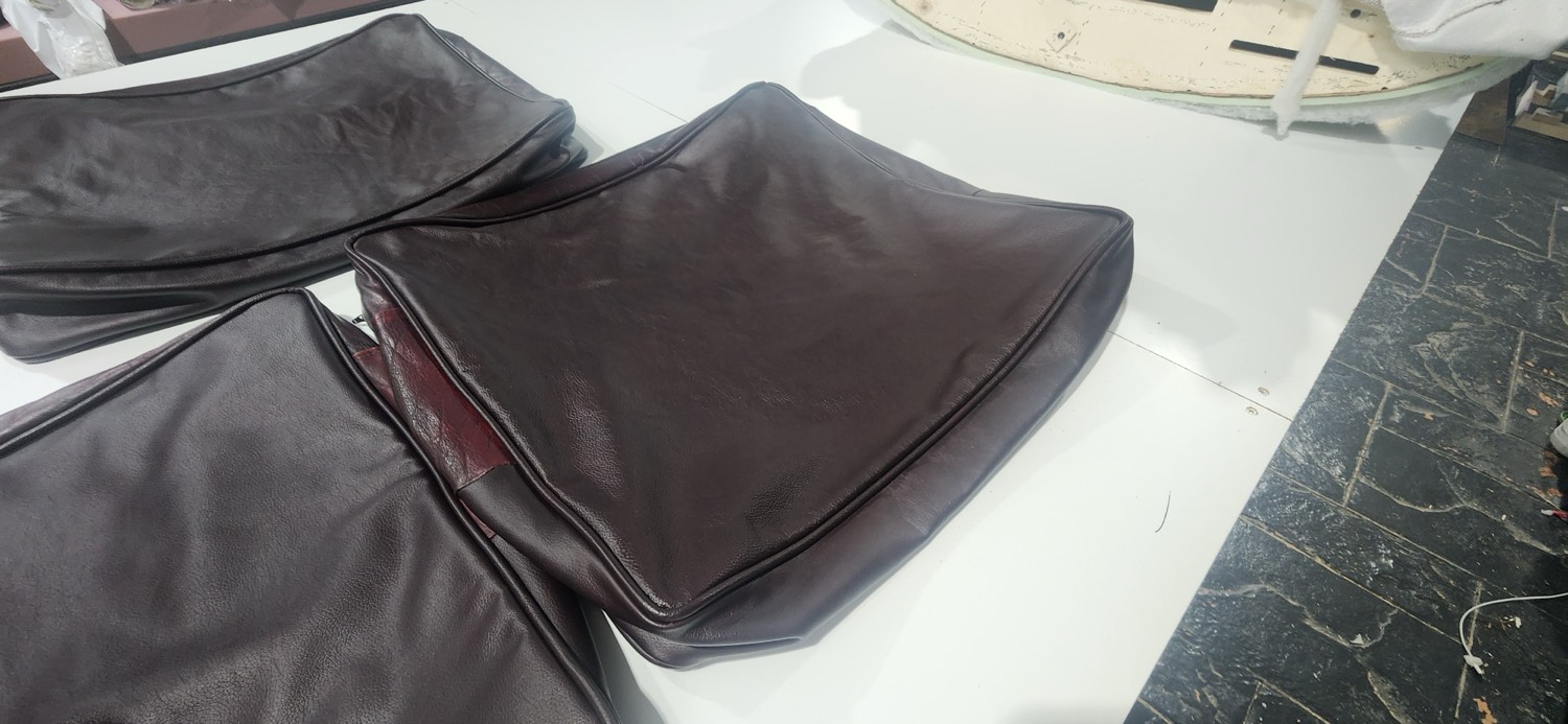 Close-up of the new Tasman rub-off leather on a Moran cushion, blended to match the original couch