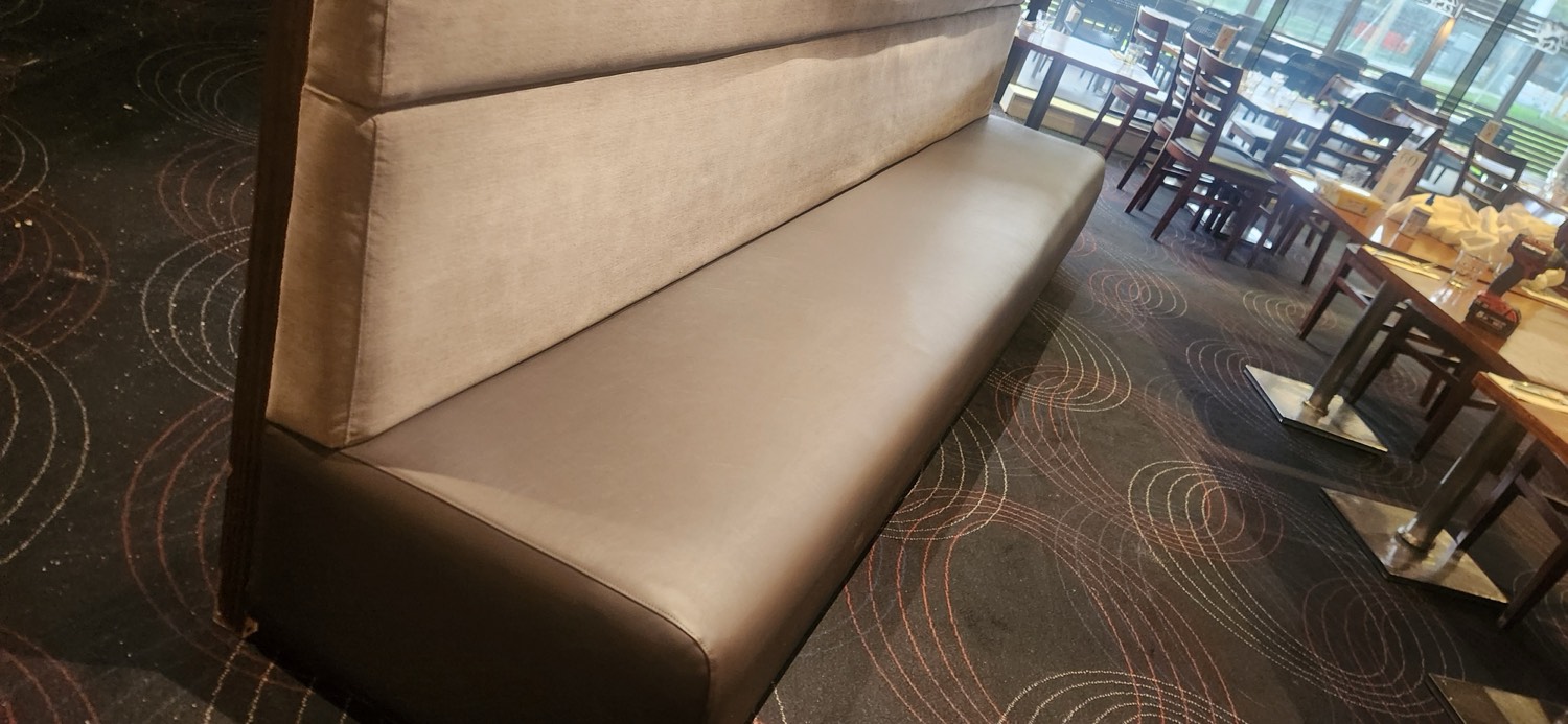 The recovered banquette at the Veneto Club Bulleen in new commercial vinyl, tables set and back in service